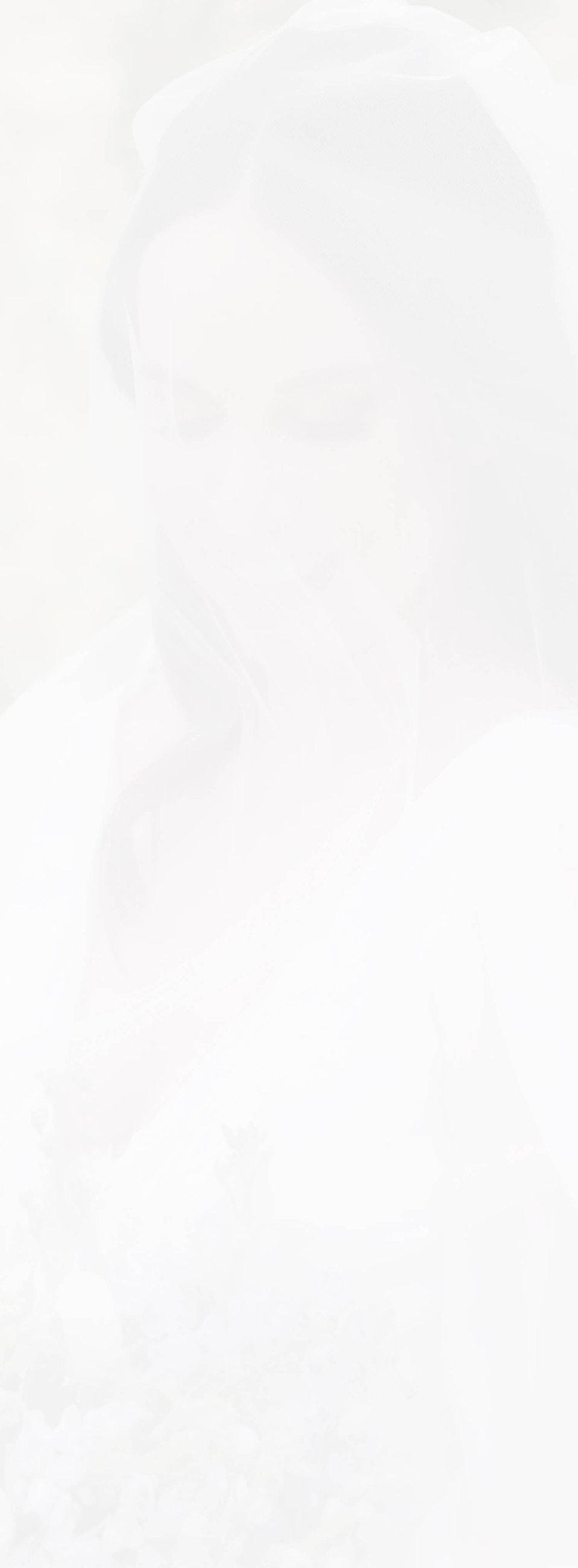 Сouple wearing a white gown and a white suit. Mobile Image