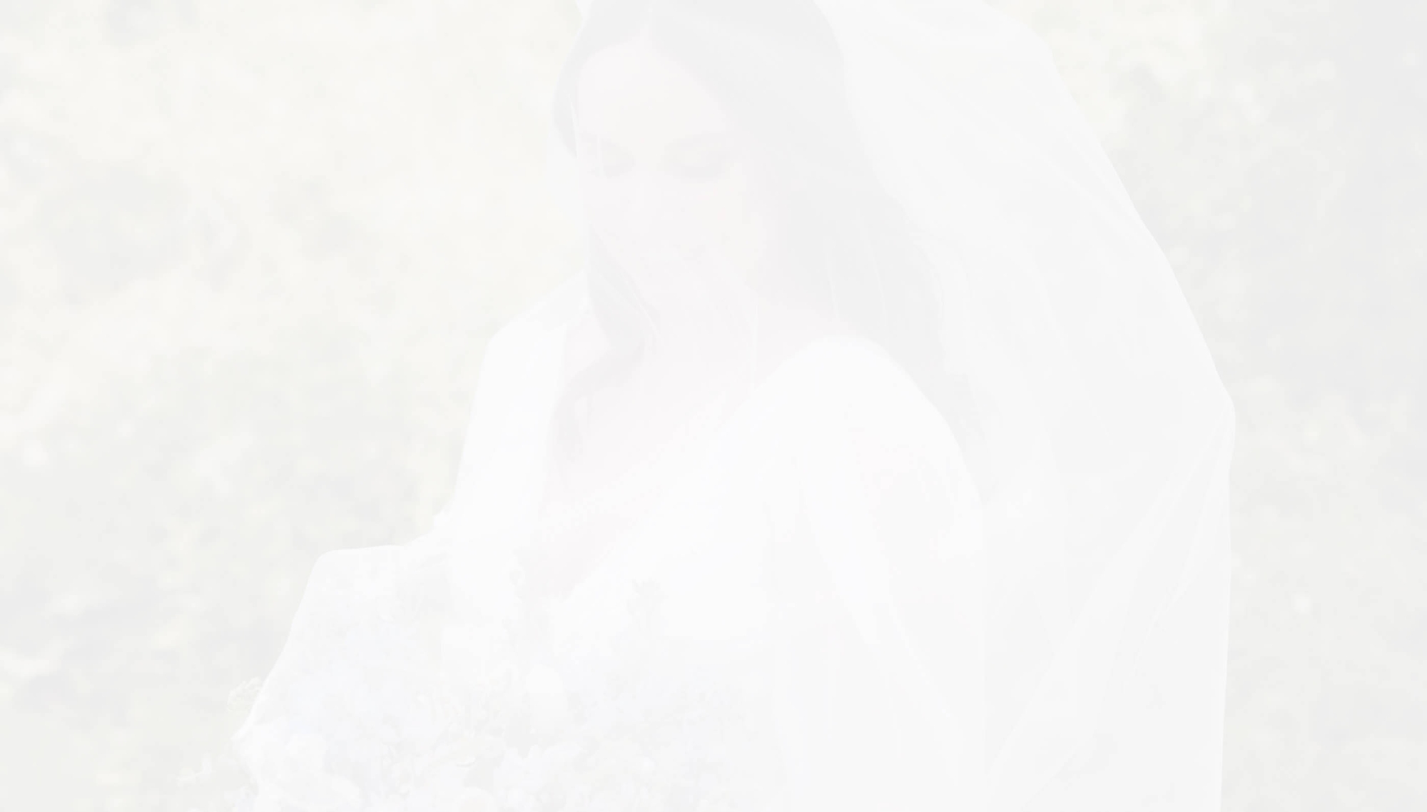 Сouple wearing a white gown and a white suit