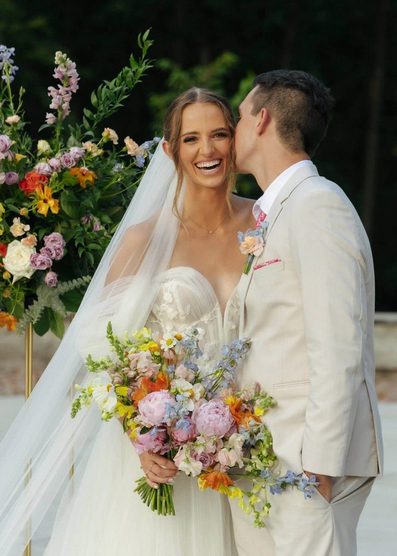 Couple wearing a white gown and a white suit